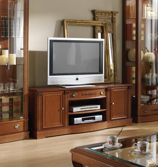 Klasický televizní stolek v hnědé barvě ořechu s originálním zdobením a lemy po obvodu dvířek.